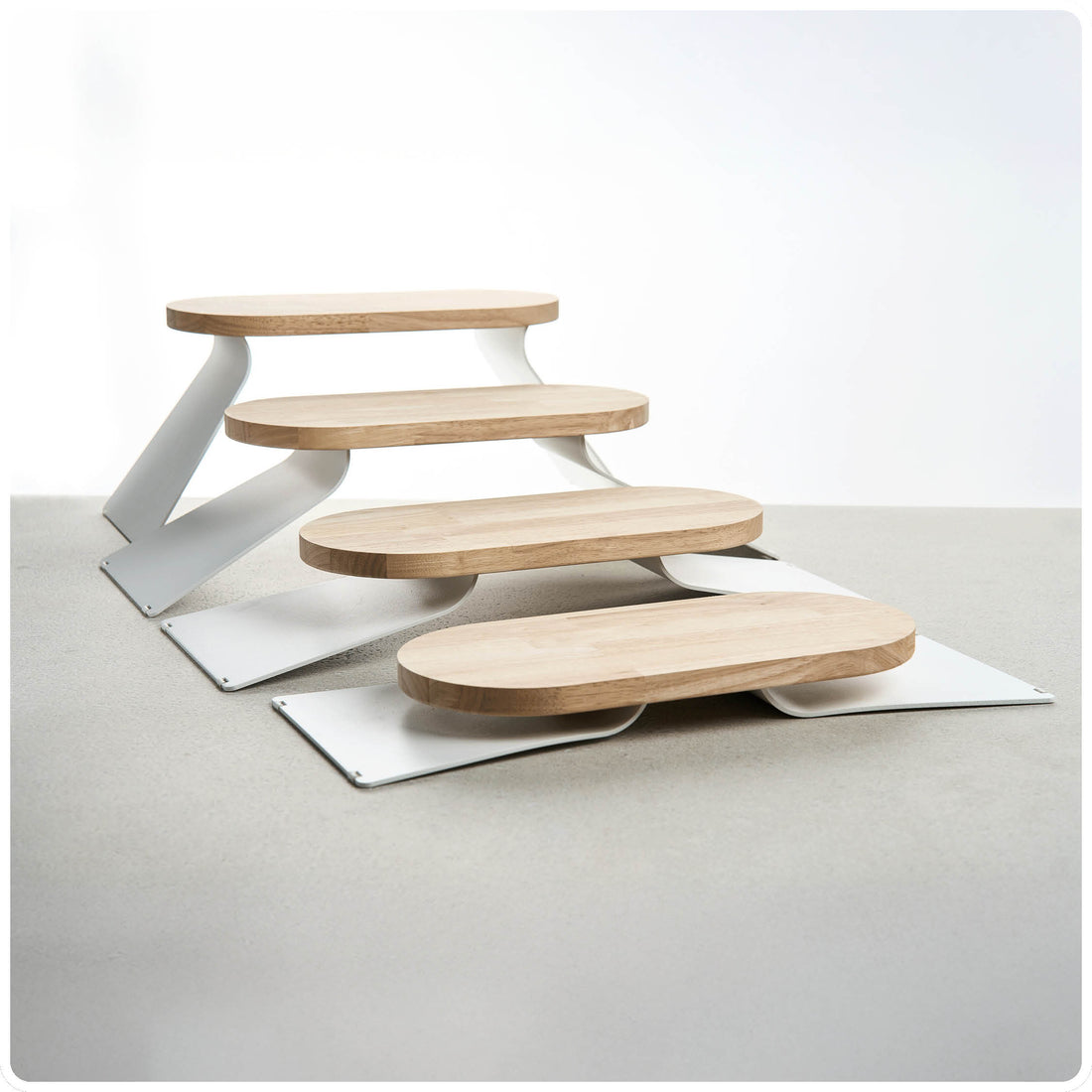 PINO Raised Tray Extensions at different height settings, side view
