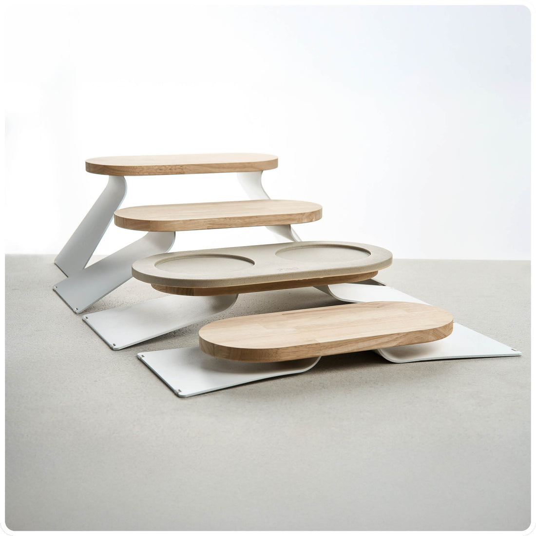 PINO Raised Tray Extensions showing the different height settings